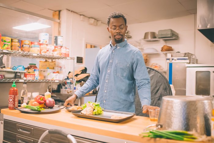 Phi Beta Sigma's Detroit Restaurant Weekend Begins February 25th (Image of Detroit Black Restaurant Week Founder Kwaku Osei-Bonsu in a restaurant kitchen.)