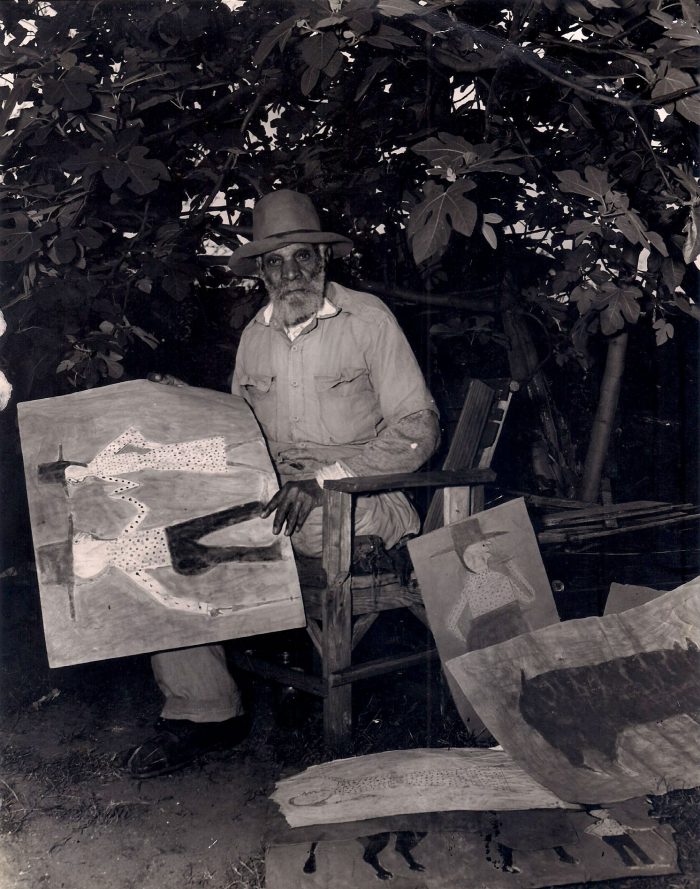Black artist Bill Traylor is pictured with his artwork. Watch the Bill Traylor: Chasing Ghosts documentary film!